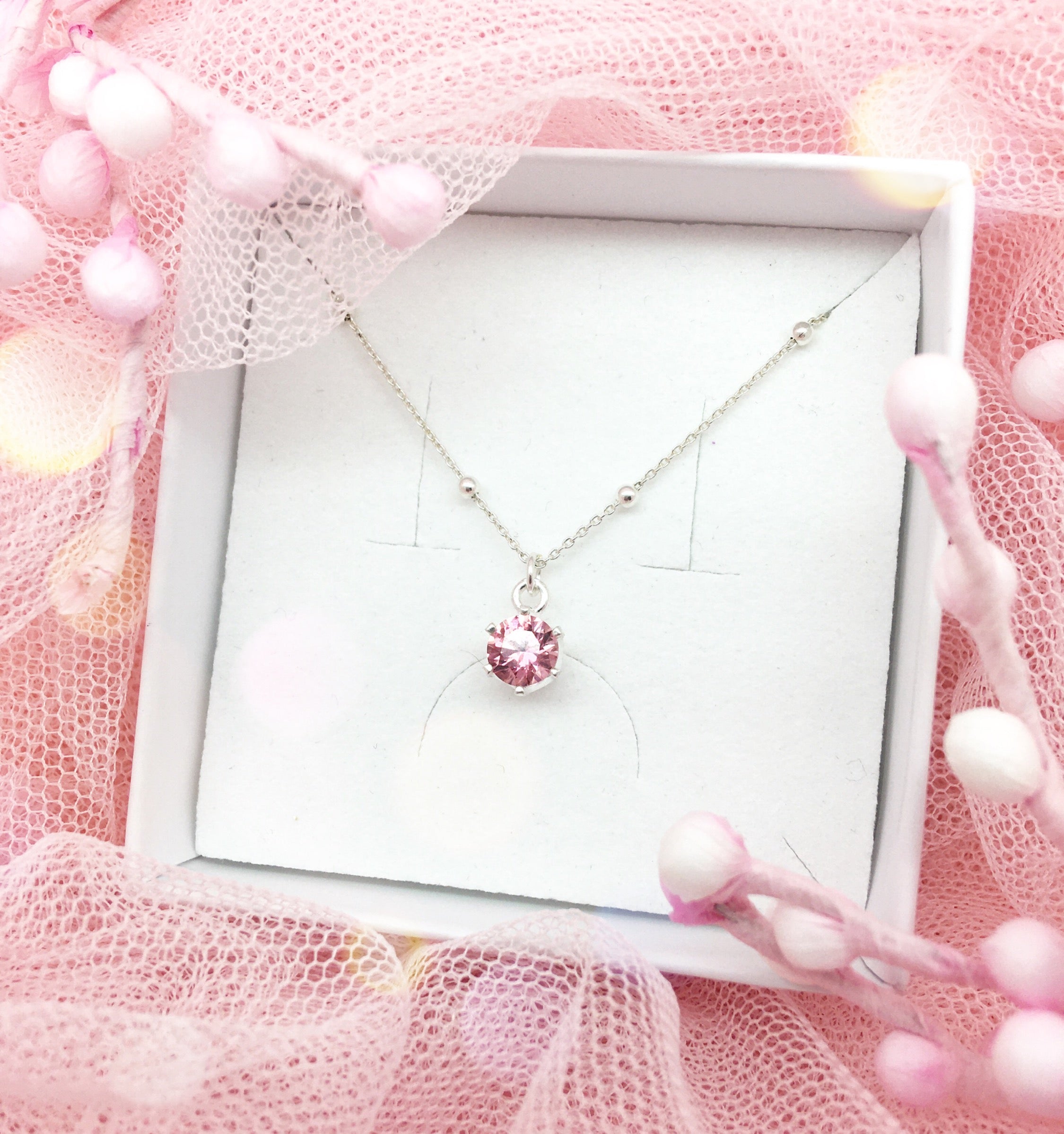 Colgante choker Swarovski con cristal rosa en colgante circular