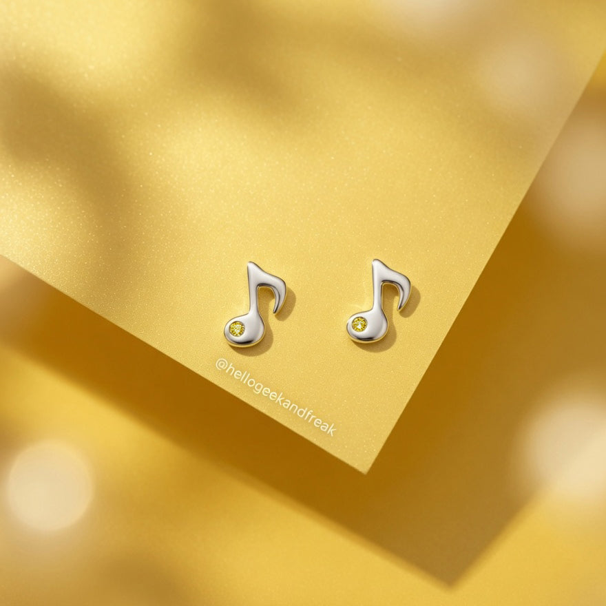 Pendientes de nota musical plateados con cristal amarillo en pareja
