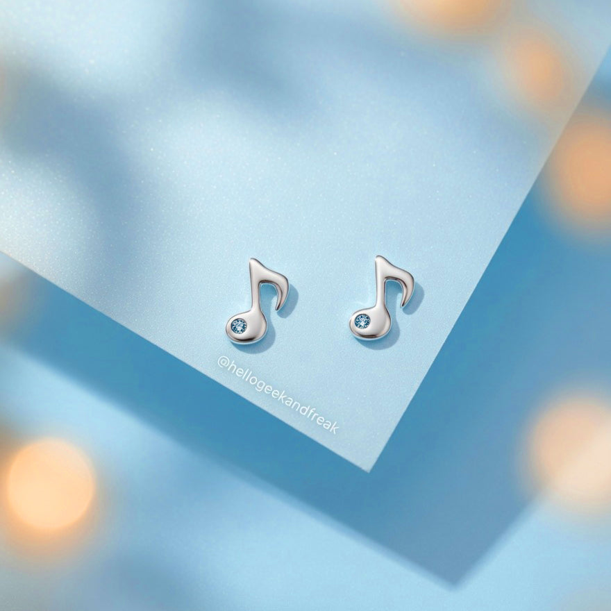 Pendientes de nota musical plateados con cristal azul en pareja