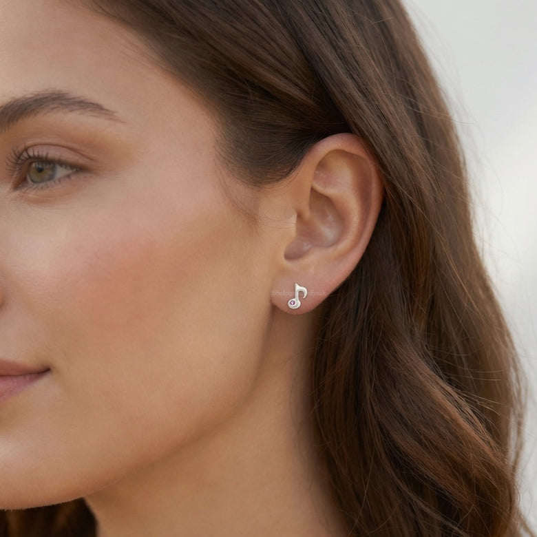 Pendientes de nota musical plateados con cristal morado