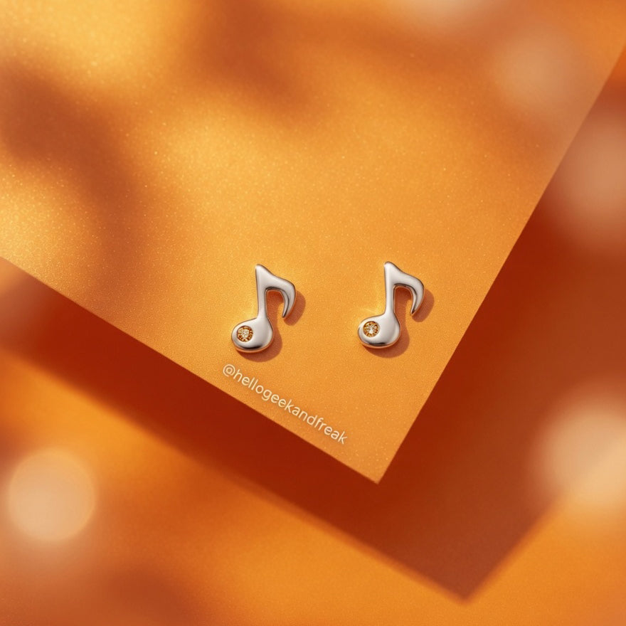Pendientes de nota musical plateados con cristal amarillo en pareja
